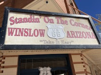 a sign that says standin on the corner in winlow, arizona